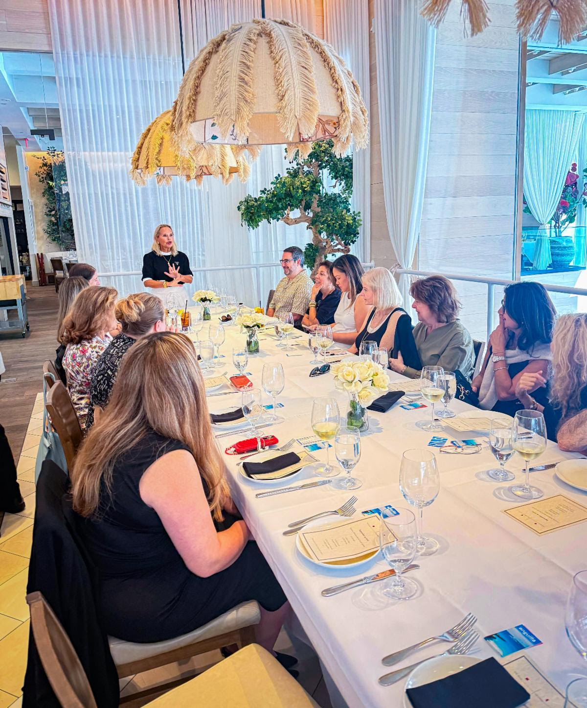 Vivian Chambers, U.S. sales representative with The Muse Collection, speaks with travel advisors during the Anguilla Destination Roadshow.
